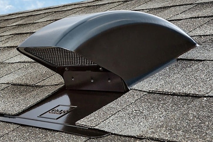 Sideview of a black Master Flow Bath and Dryer Vent from GAF on a brown shingled rooftop