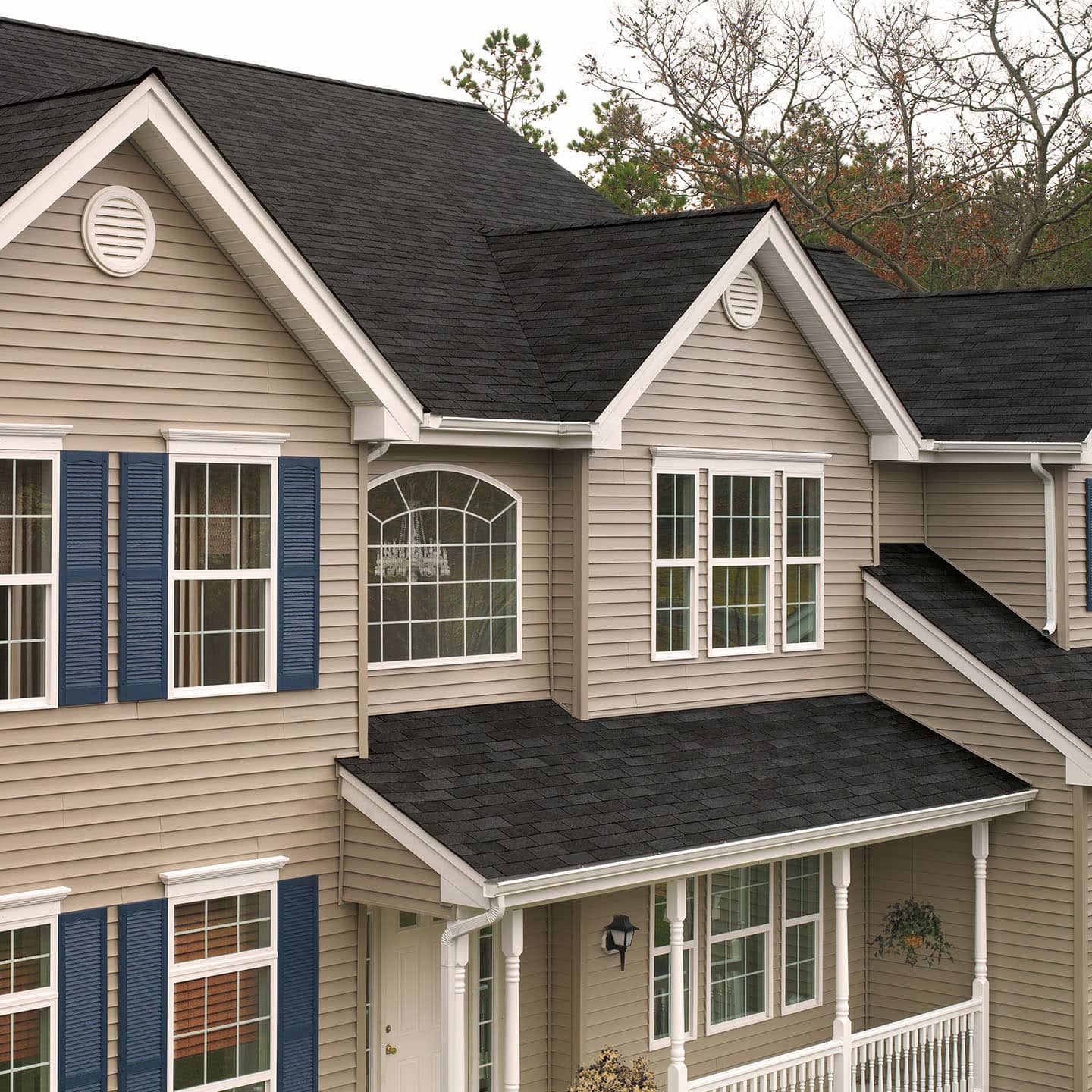 Beige home with black Royal Sovereign roof shingles
