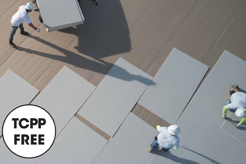 Three GAF contractors laying down and aligning TCPP-free NH polyiso products with TCPP free icon
