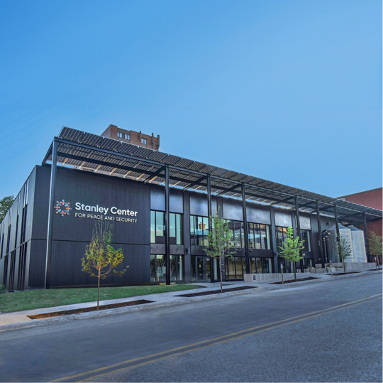 Modern exterior of the Stanley Center commercial building featuring a flat roof canopy structure.