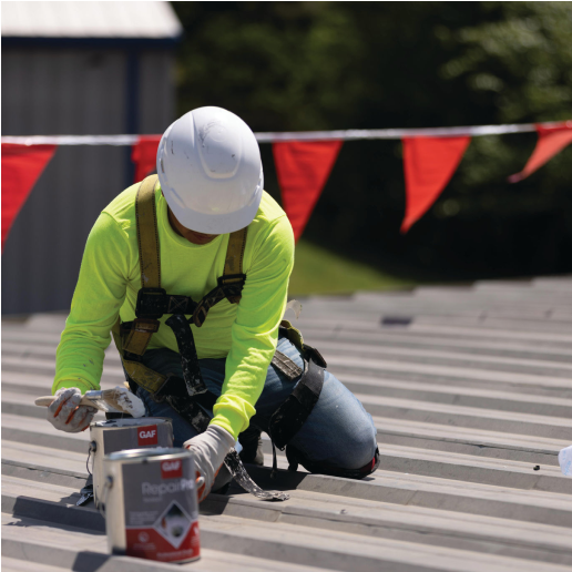 Contractor sealing metal roof