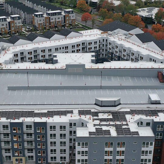 Aerial view of the Avalon Bothell Commons residential and mixed-use community rooftops