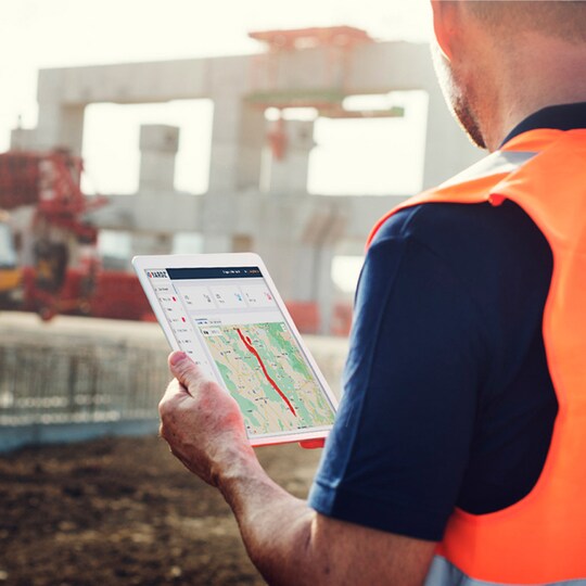A contractor using YARDZ software on a tablet