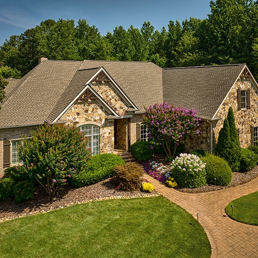 Bird’s eye view of a house built with impact-resistant Timberline ASII shingles