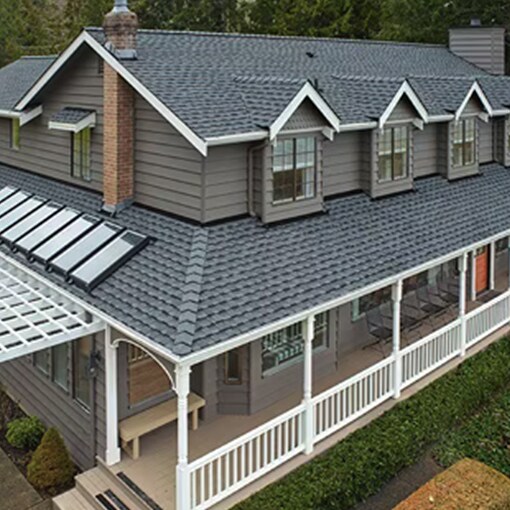Bird’s eye view of a house built with GAF Timberline UHDZ asphalt shingles 