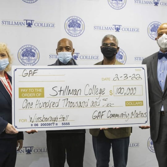GAF employee presenting check to Stillman College