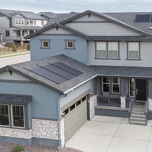 Bird’s eye view of a house that a building developer built with the Timberline solar roof system. 