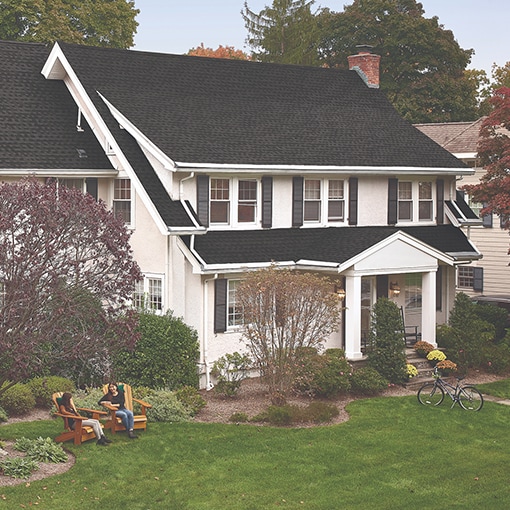 Front view of a house with a roof installed with GAF products that are protected by GAF’s strong warranties. 
