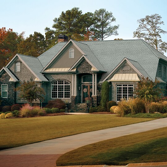 Home with light gray GAF roof shingles