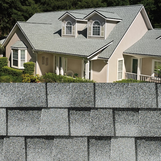 GAF Timberline HDZ® Birchwood Shingle closeup with sample product image on a beige house.