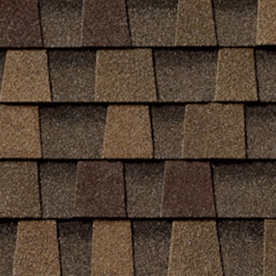 Textured brown GAF Timberline® shingles arranged in a layered pattern