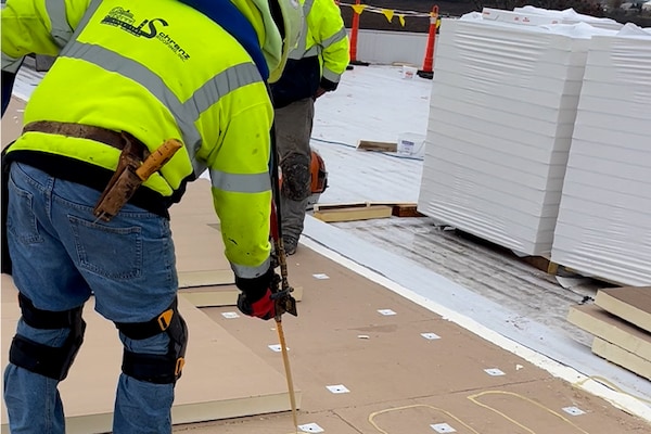 M.M. Schranz Roofing, Inc. contractors working on the roof of the Wisconsin Saputo Cheese facility