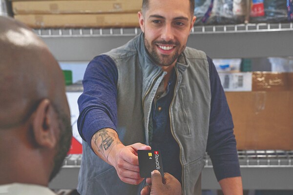 A GAF-certified contractor purchasing roofing products at a store that are eligible for GAF Rewards points