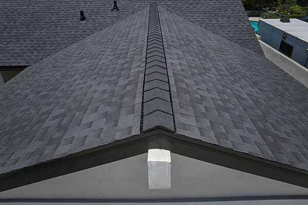 Bird's eye view of a residential roof with GAF Timberline HDZRS shingles installed.