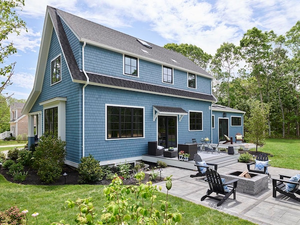 Light blue house with gray GAF shingle roof