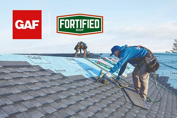 The GAF logo and the Fortified Roof logo are displayed above two contractors working to install new shingles on a roof over a blue underlayment.