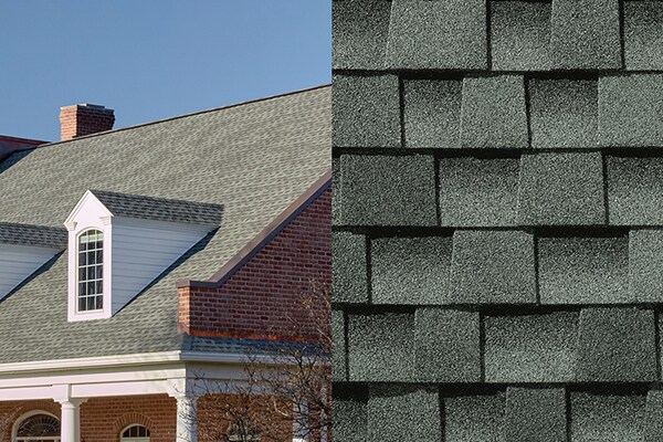 A close-up photo of Timberline HDZ Slate shingles placed next to a house built with those shingles on its roof.