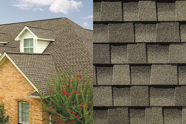 A close-up photo of Timberline HDZ Weathered Wood shingles placed next to a house built with those shingles on its roof.