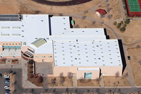 Aerial view of Santa Fe Community College building with a newly coated flat roof.
