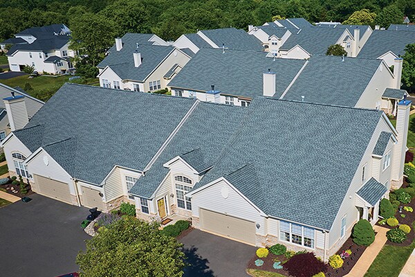 Gray GAF roofing shingles on multi-family homes
