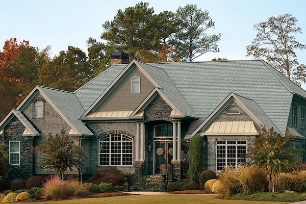 Home with light gray GAF roof shingles