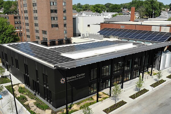 An aerial photo of the Stanley Center roof covered in solar panels.