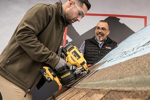 Residential roofer training with nail gun at GAF CARE contractor training center 