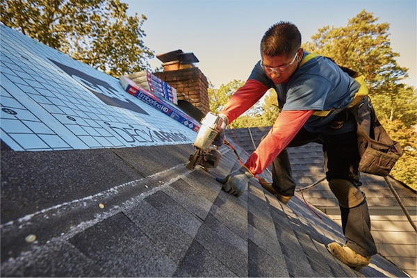Contractor installing Timberline HDZ® Shingles on a residential roof.
