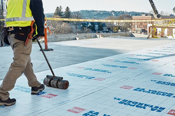 contractor rolling out GAF Vapor Retarder