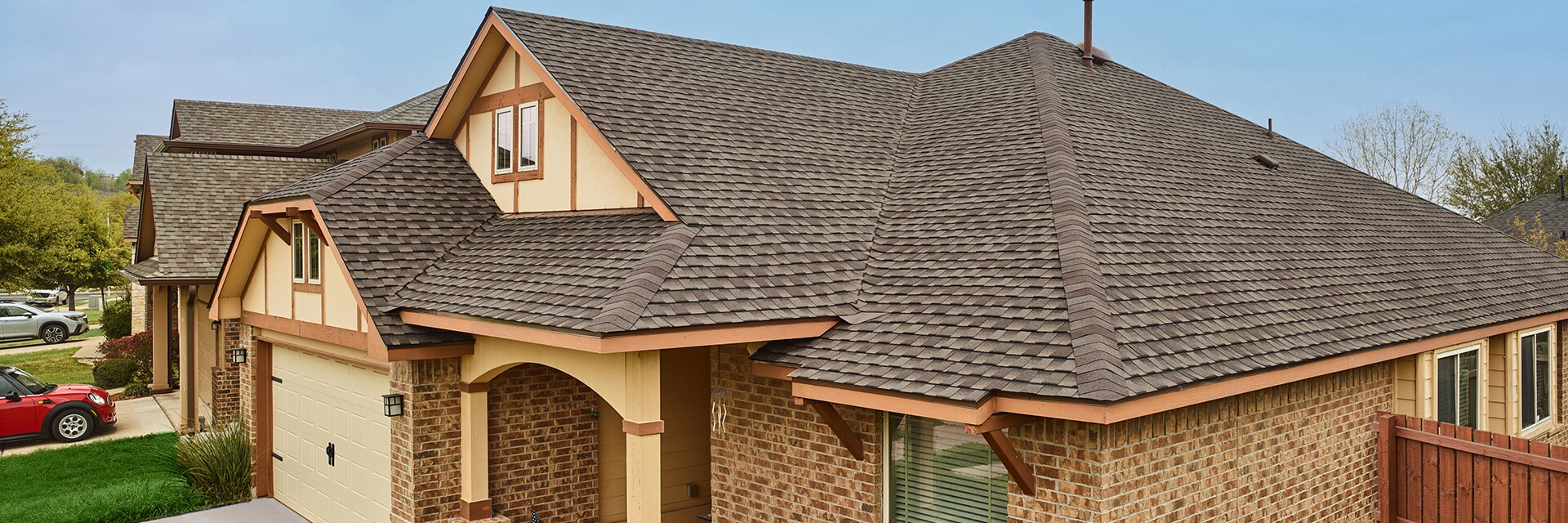 Tan house with Timberline UHDZ Barkwood shingles