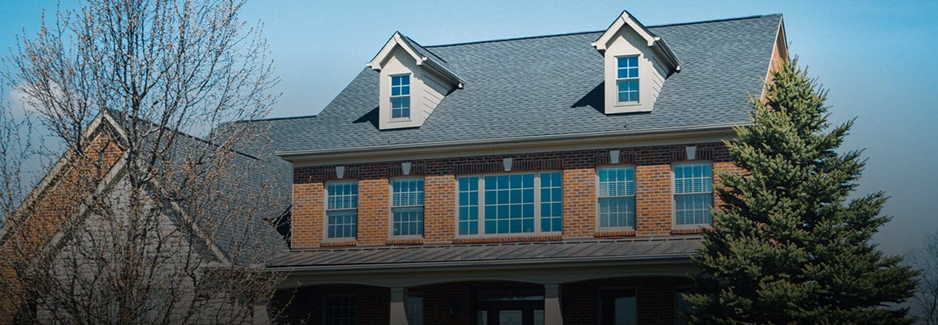 Aerial view of a house with GAF shingles installed on the roof