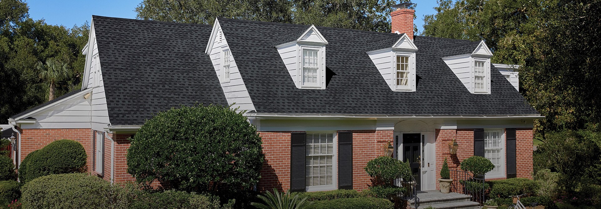 Residential home with Charcoal shingles made by GAF