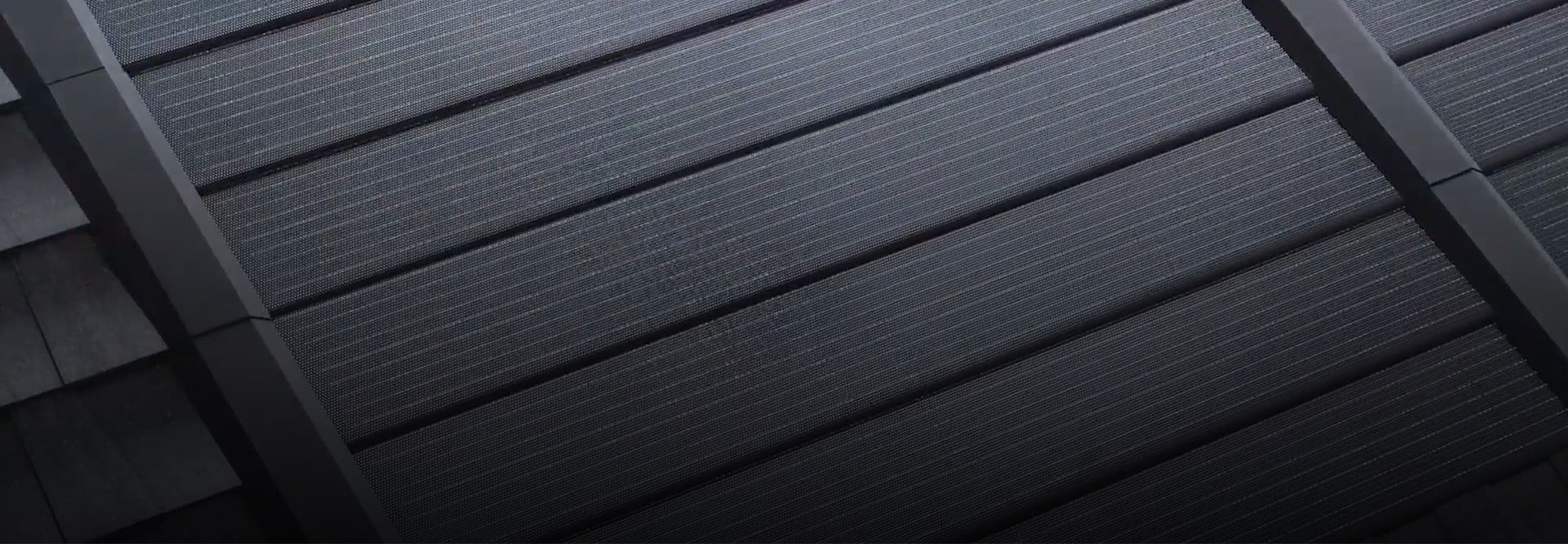 Closeup photo of solar tiles that are part of the Solar Timberline Roofing System. 