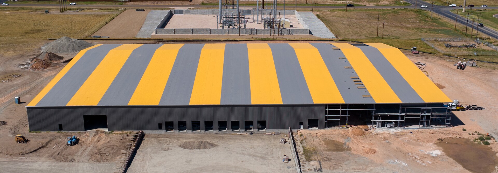 Aerial view of Austin Hose headquarters roof with distinctive colors made from GAF commercial roofing materials