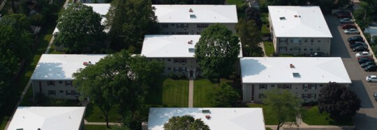 Aerial view of the Post House, a multi-family HOA with 12 buildings, showcasing their newly recovered roofs with GAF materials.