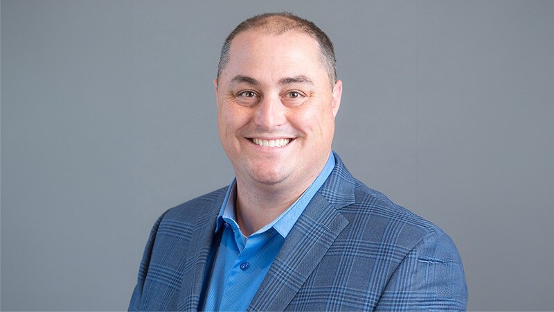 Head shot of Benjamin Runyan,  the Director of Product Management for PVC and Modified Bitumen Systems