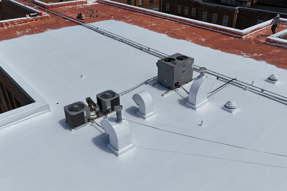 Aerial view of the new liquid-applied roofing system being installed on the Link Centre roofs in Tupelo, MS.