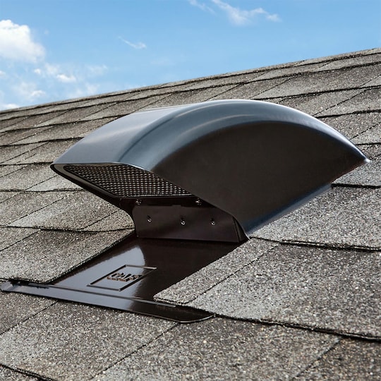 Sideview of a black Master Flow Bath and Dryer Vent from GAF on a brown shingled rooftop