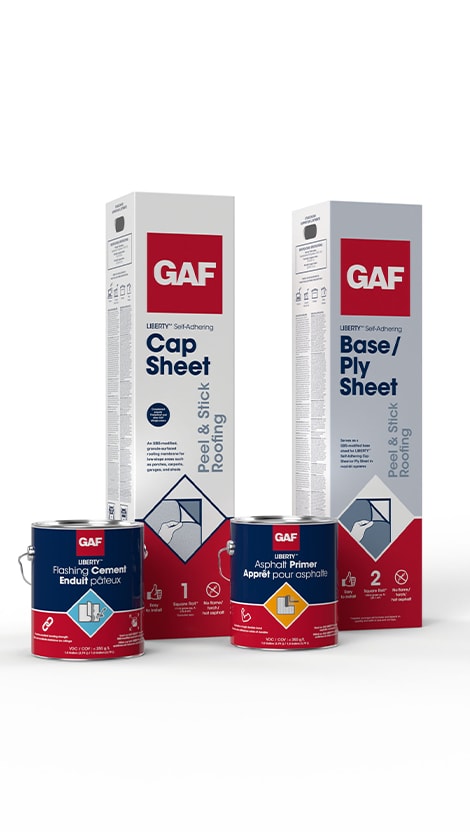 Products in GAF's Liberty Roll Roofing System, including two tall, rectangular boxes containing the Liberty Self-Adhering Cap Sheet and the Liberty Self-Adhering Base/Ply Sheet, sitting next to cans of GAF Flashing Cement and GAF Asphalt Primer.   Reply