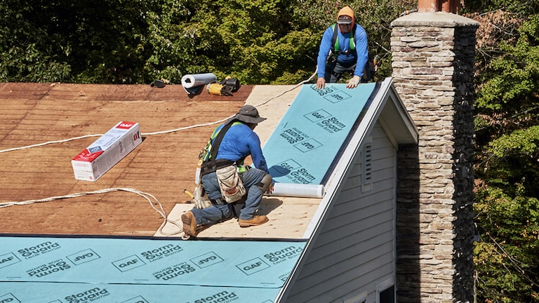 Contractors certified by GAF installing a stronger edge as part of a Fortified roofing system