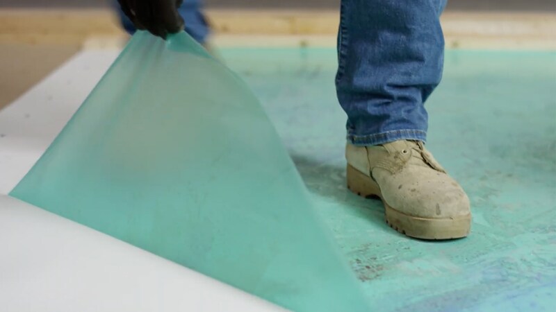 Contractor pulling back the MembraneShield film